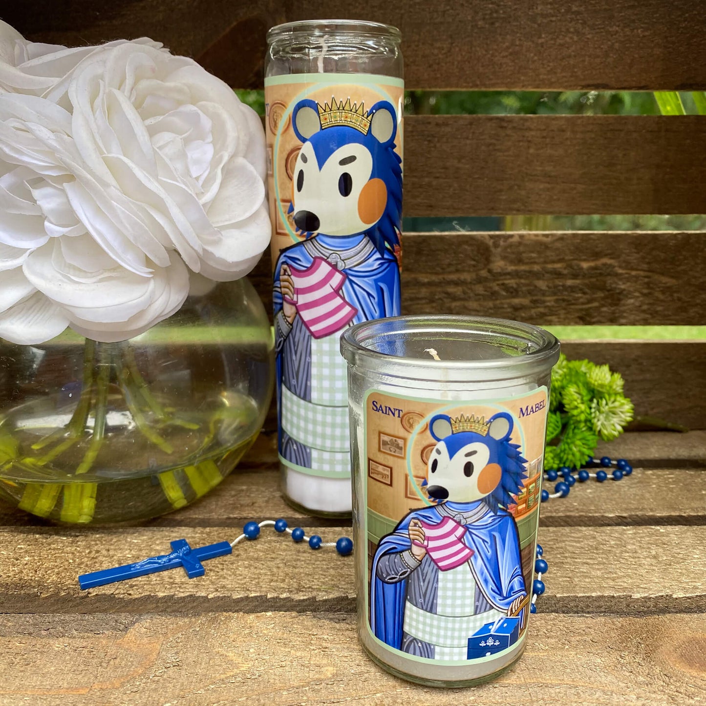 a couple of candles sitting on top of a wooden table