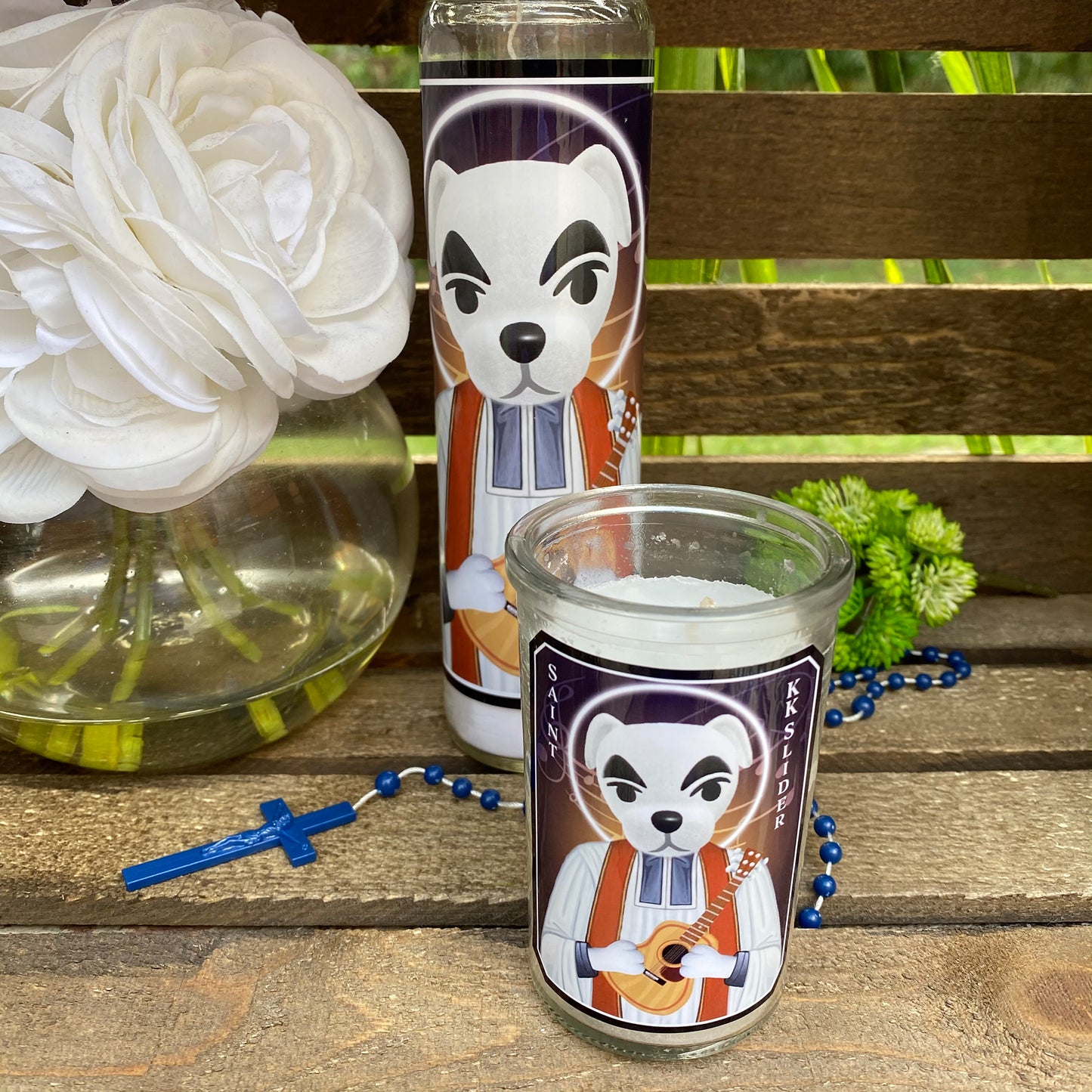 a couple of candles sitting on top of a wooden table