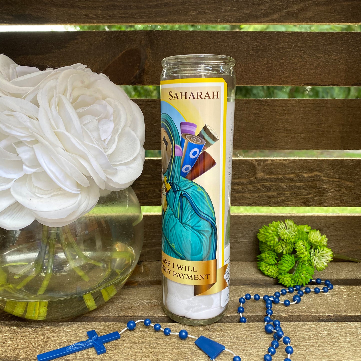 a candle and some flowers on a table