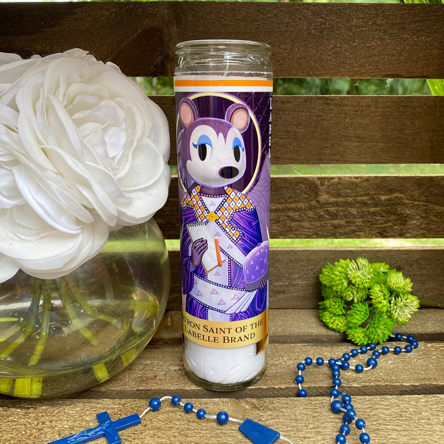 a candle with a picture of a cartoon character on it