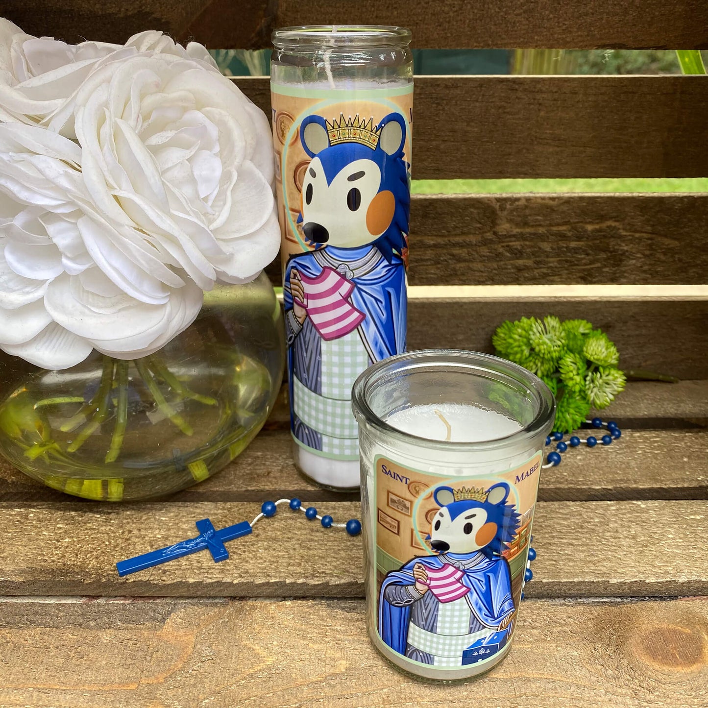 a couple of candles sitting on top of a wooden table