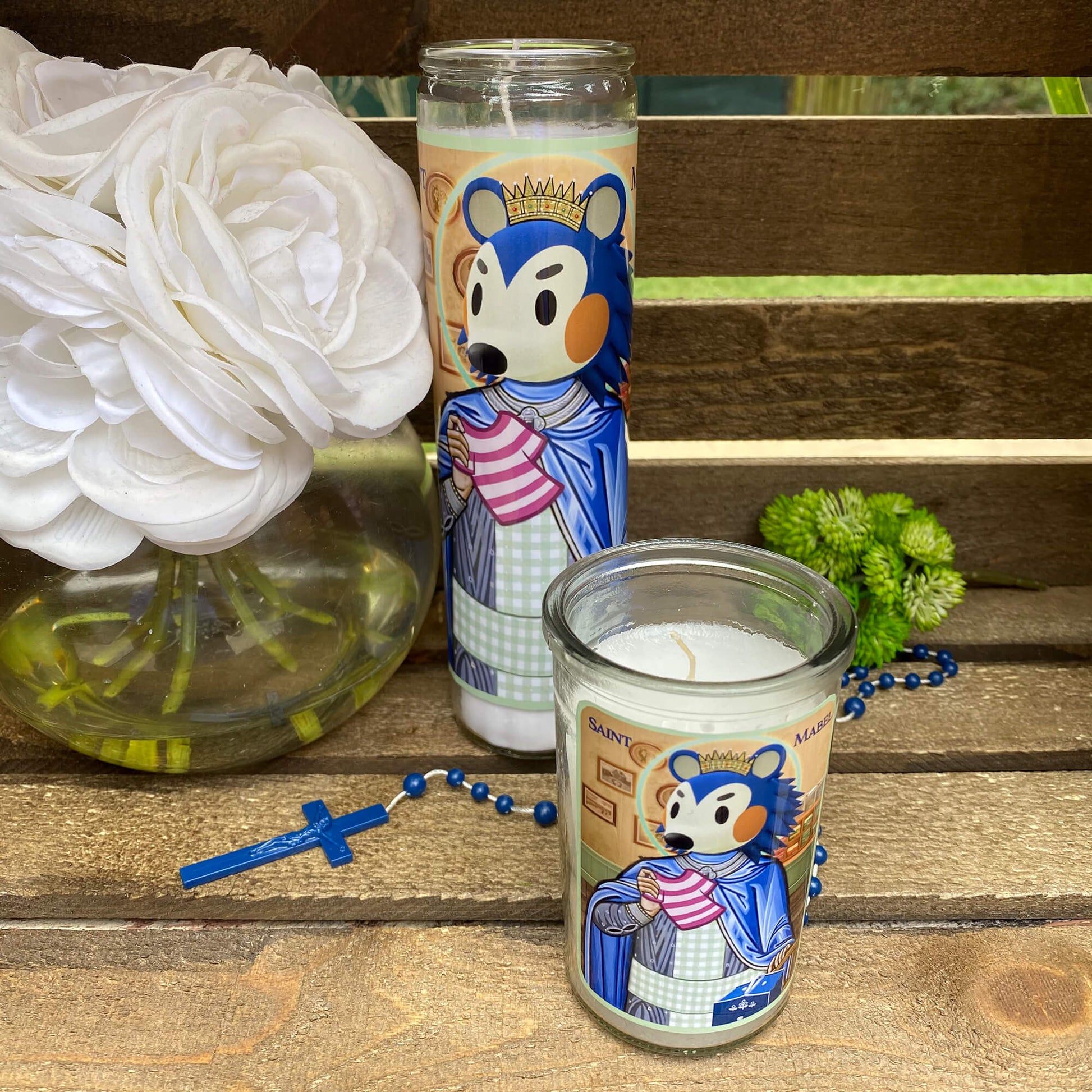 a couple of candles sitting on top of a wooden table