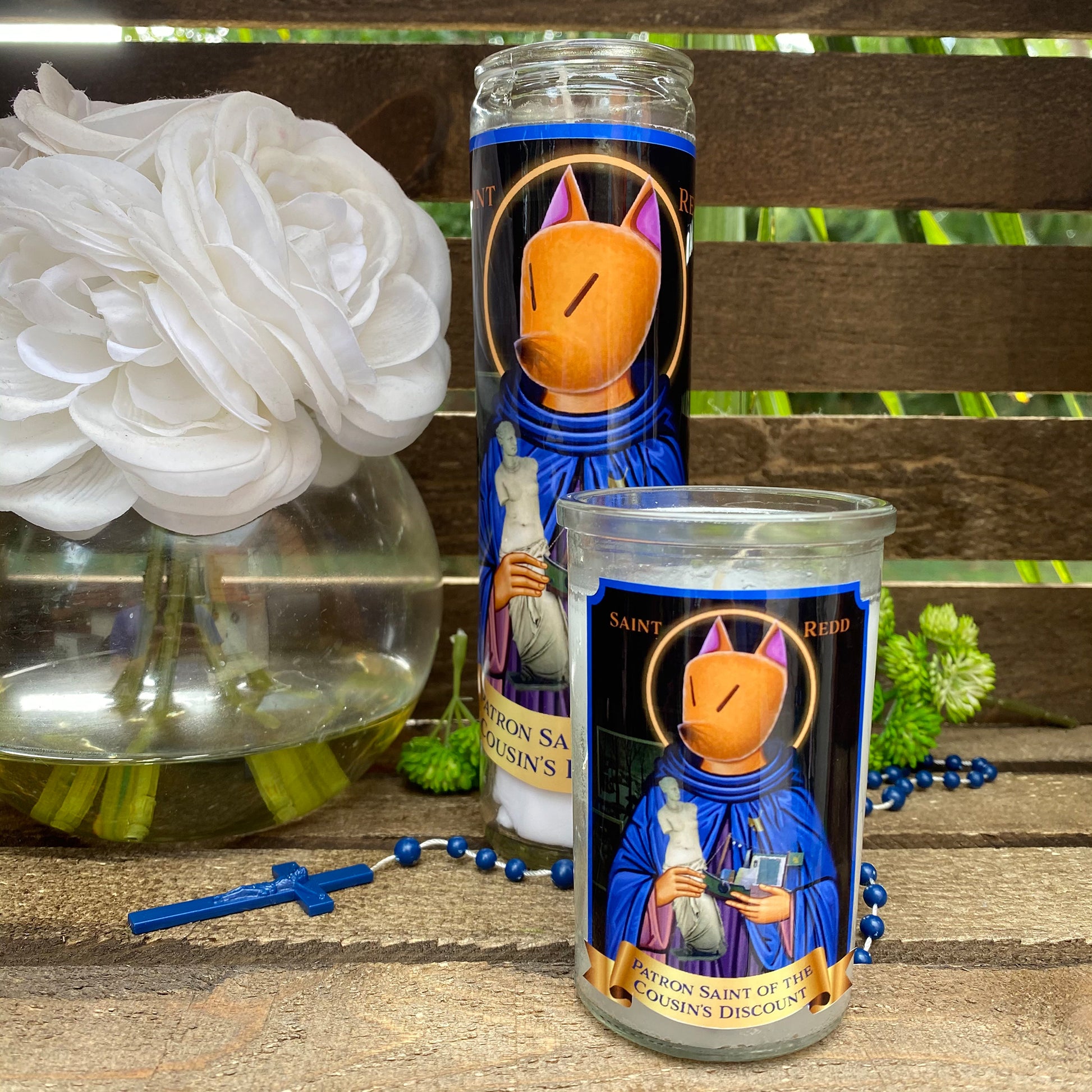 a couple of candles sitting on top of a wooden table