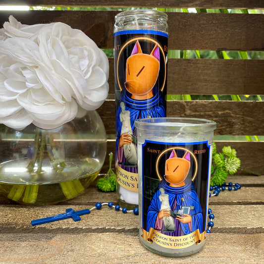 a couple of candles sitting on top of a wooden table