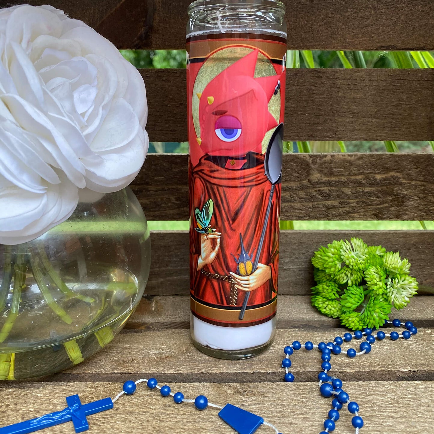 a candle and some flowers on a table