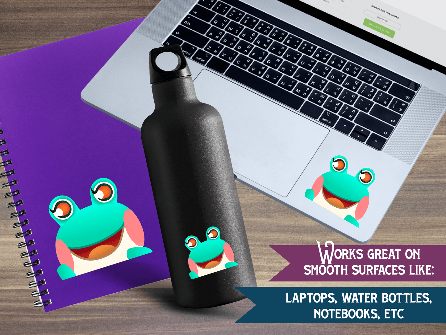 a water bottle next to a laptop on a desk