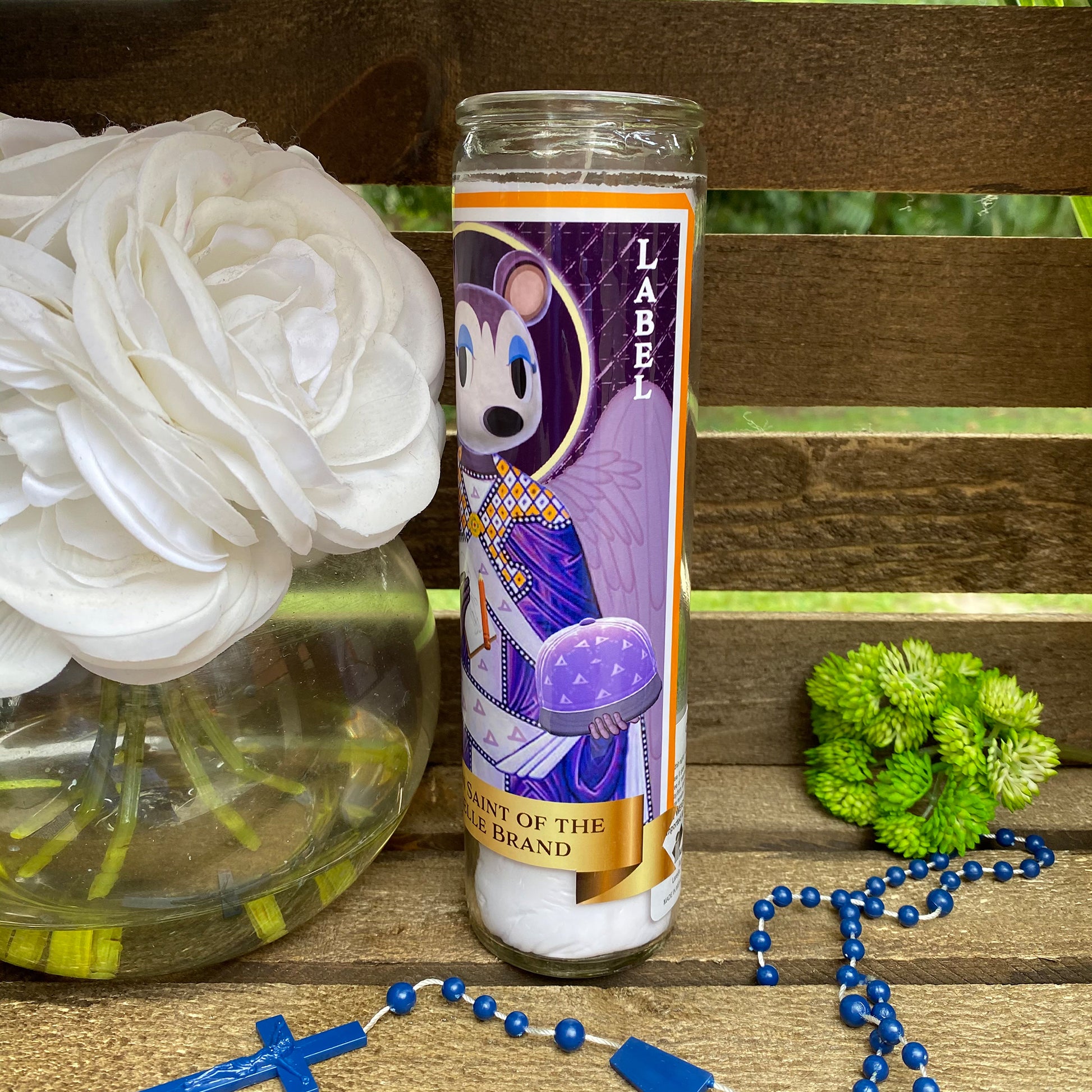 a candle and some flowers on a table