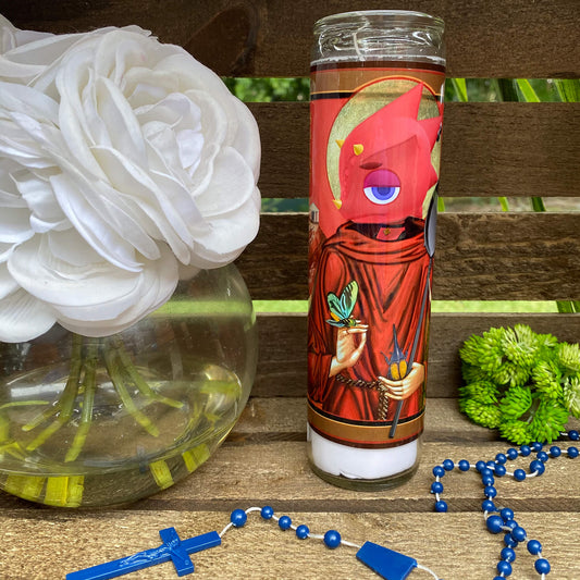 a vase with flowers and a candle on a table