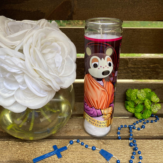 a vase of flowers and a rosary on a bench