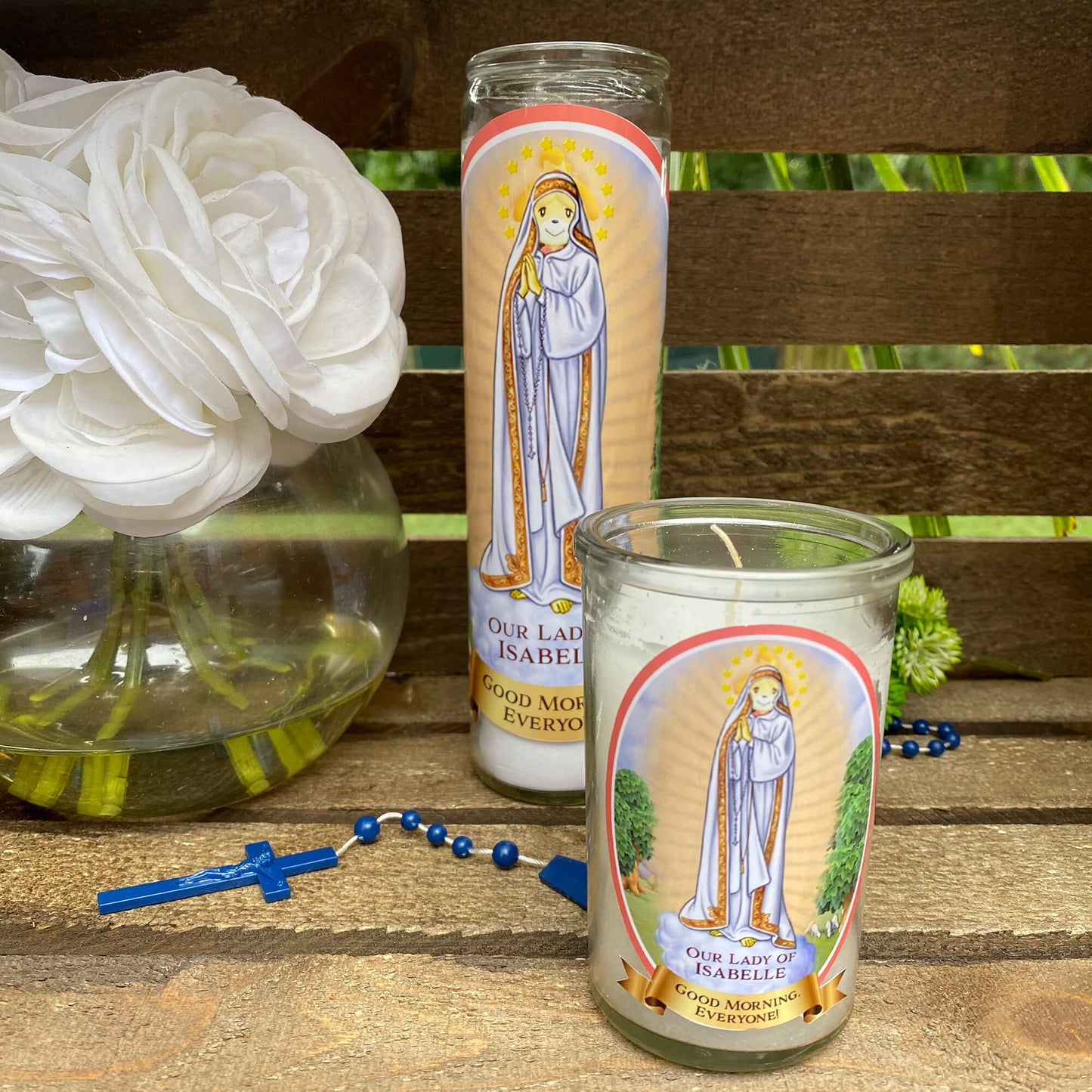 a couple of candles sitting on top of a wooden table