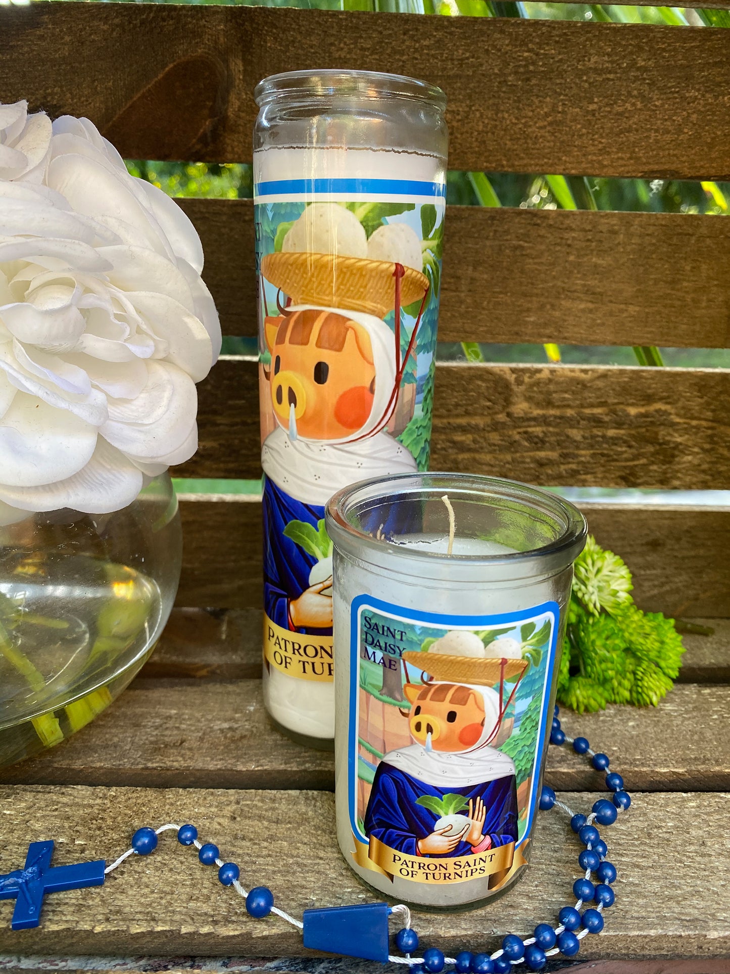 a couple of candles sitting on top of a wooden table