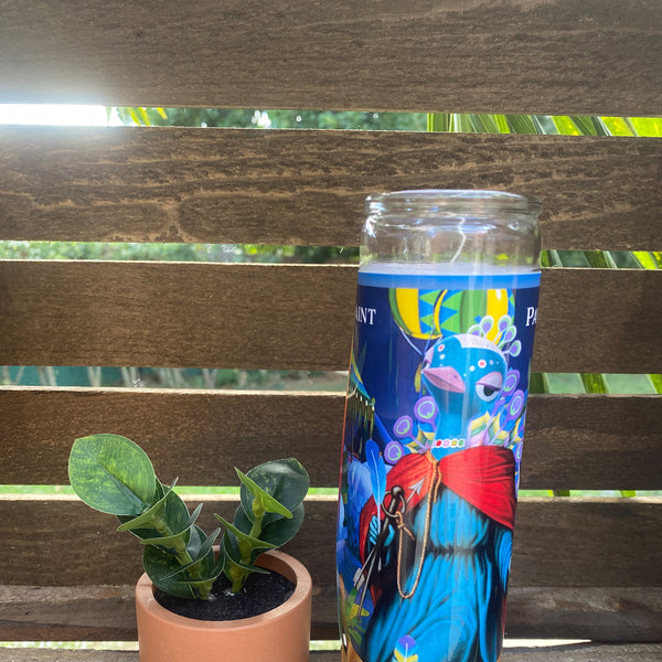 a cup of coffee next to a plant on a bench