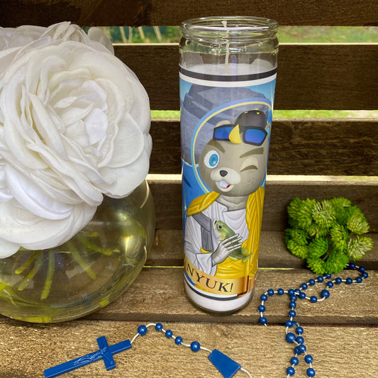 a vase with a flower and a rosary on a table