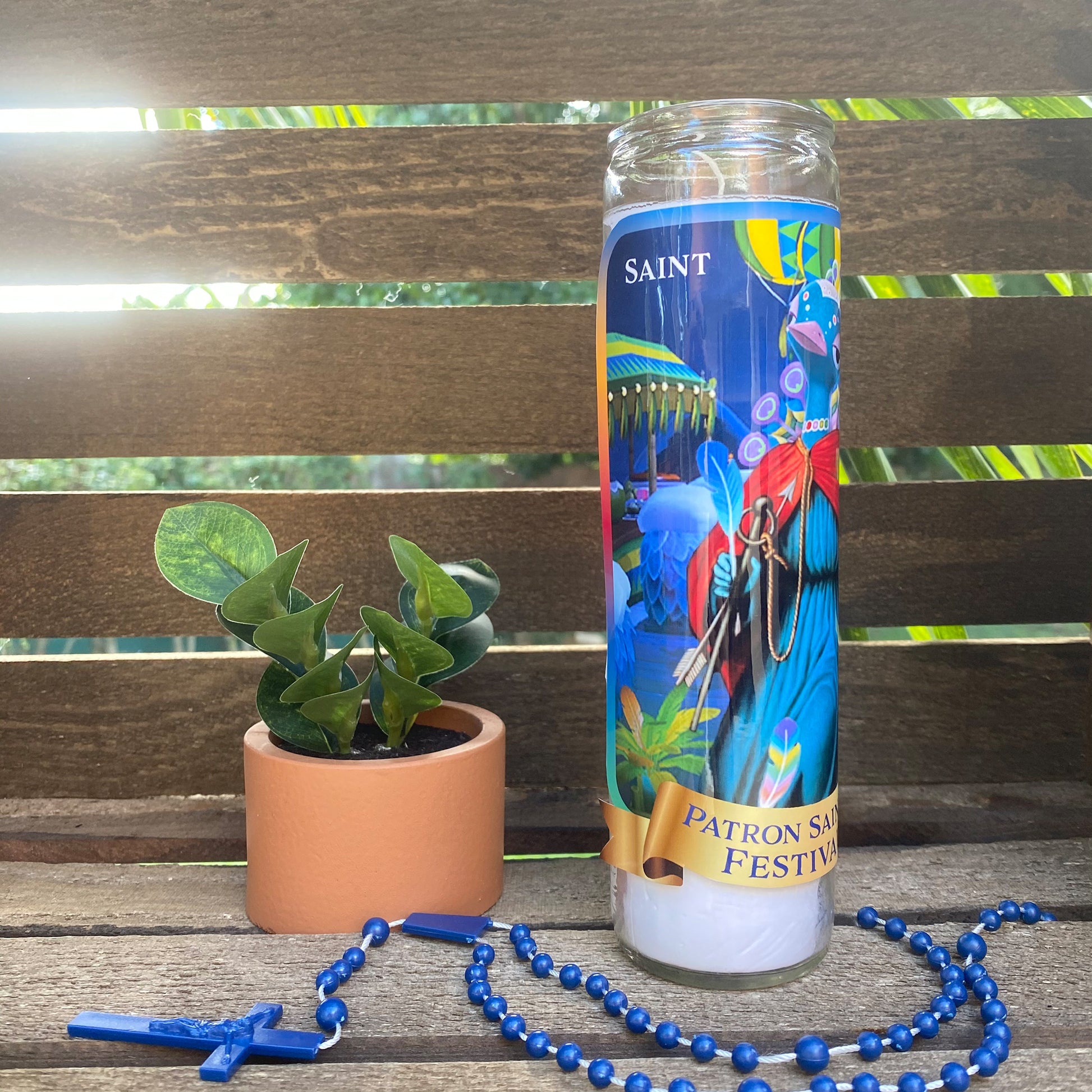 a candle and a chain on a wooden bench