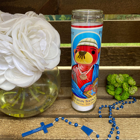 a vase of flowers and a rosary on a bench