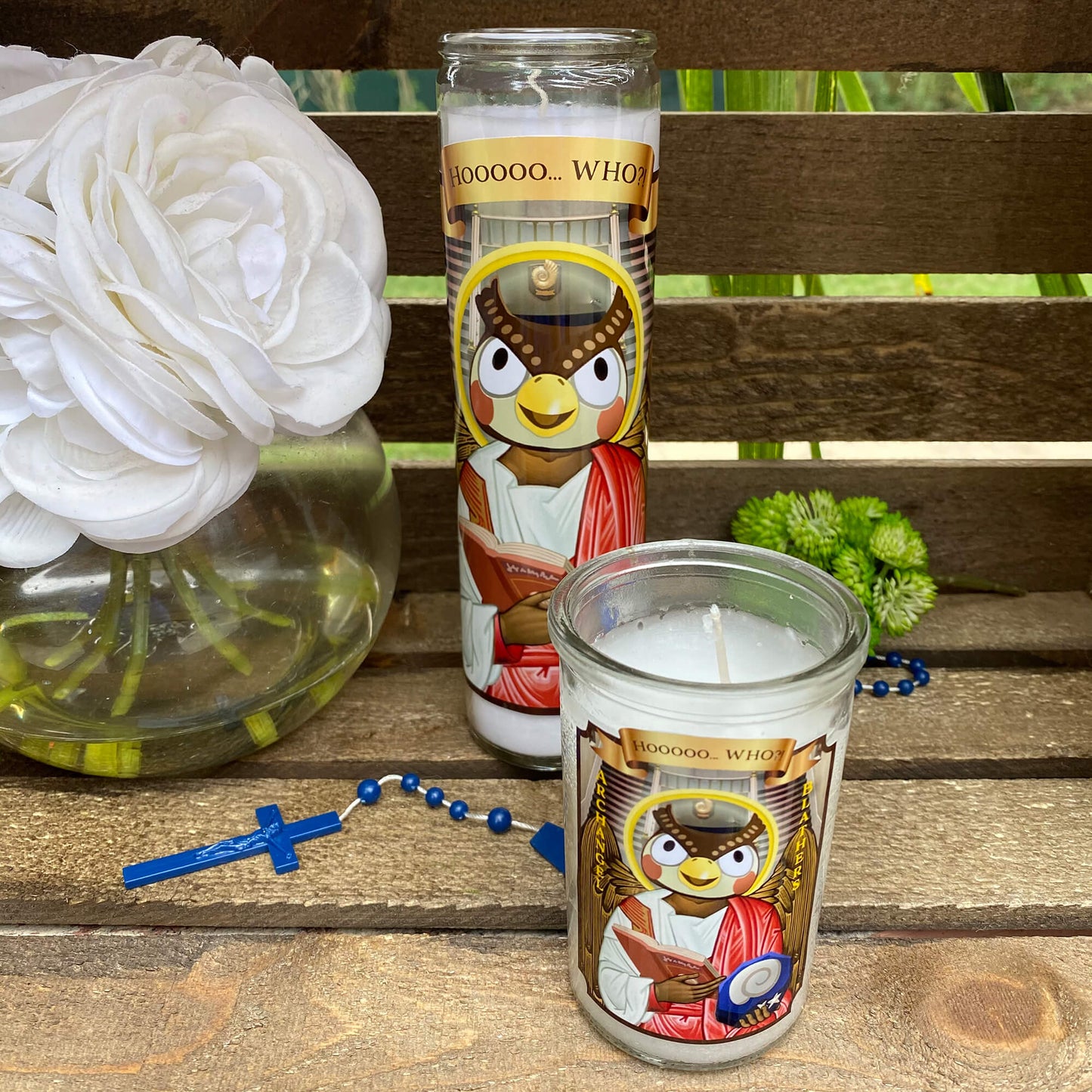 a couple of candles sitting on top of a wooden table