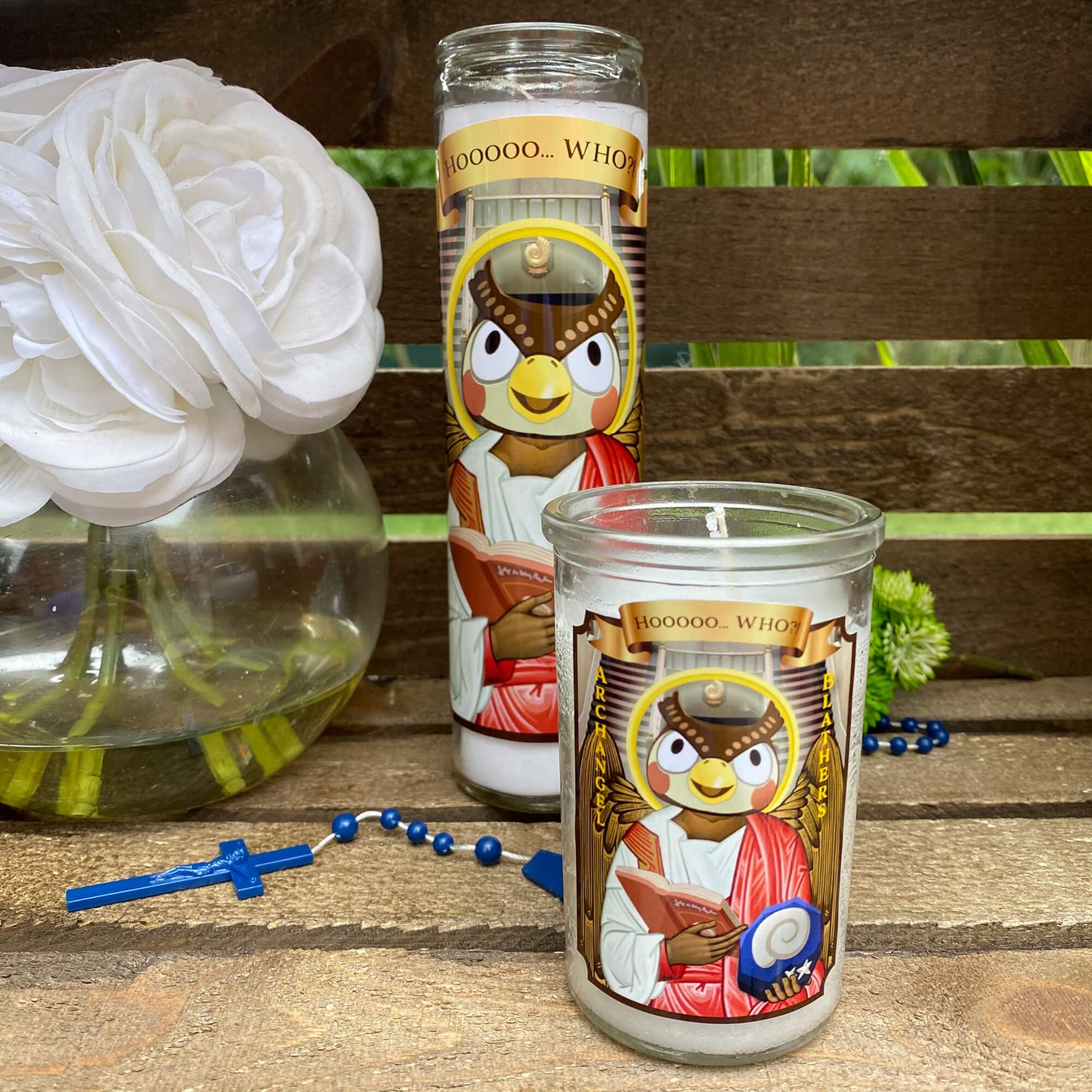 a couple of candles sitting on top of a wooden table