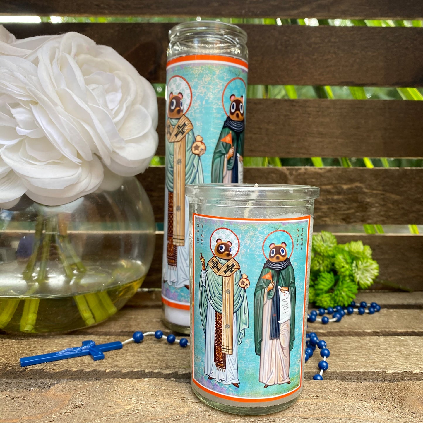 a couple of candles sitting on top of a wooden table