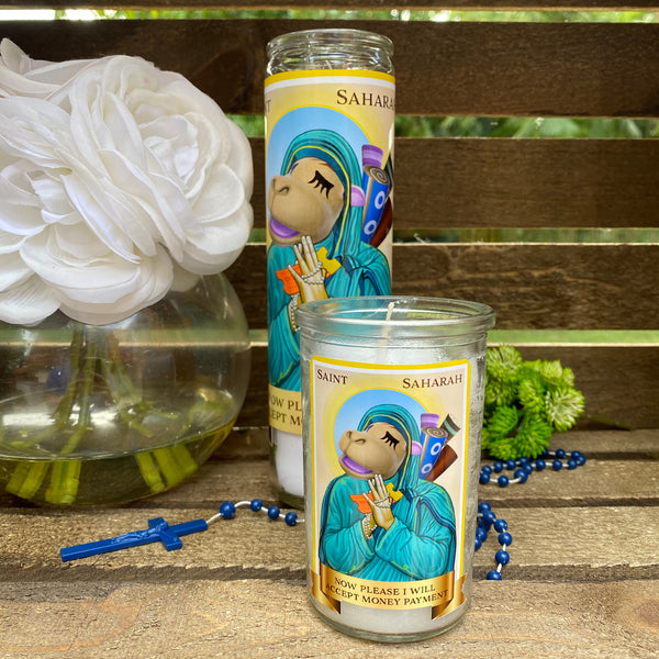 a couple of candles sitting on top of a wooden table